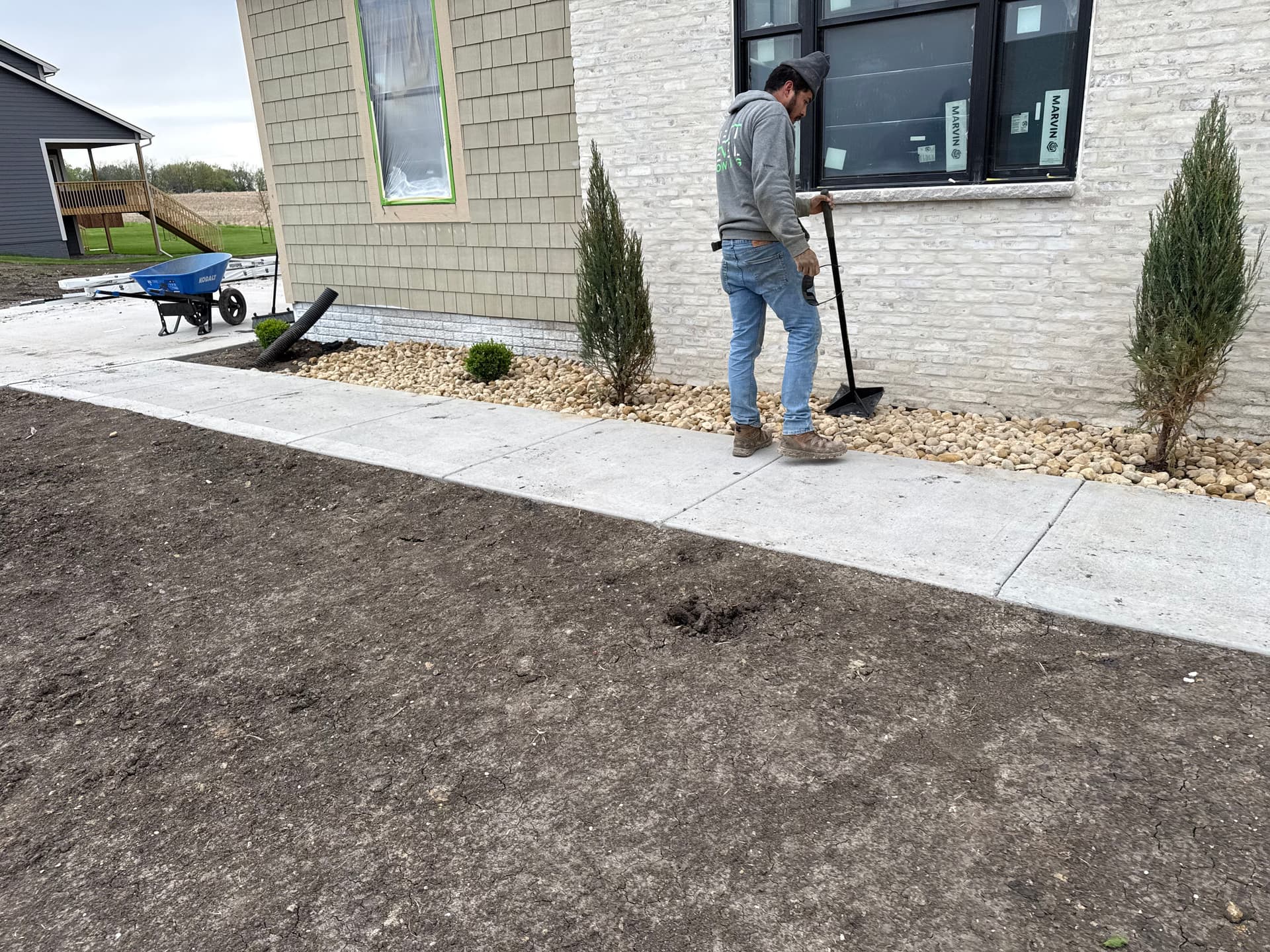 Gallery photos for New Construction Landscape Work with Iowa Buff and River Rock: Image #3