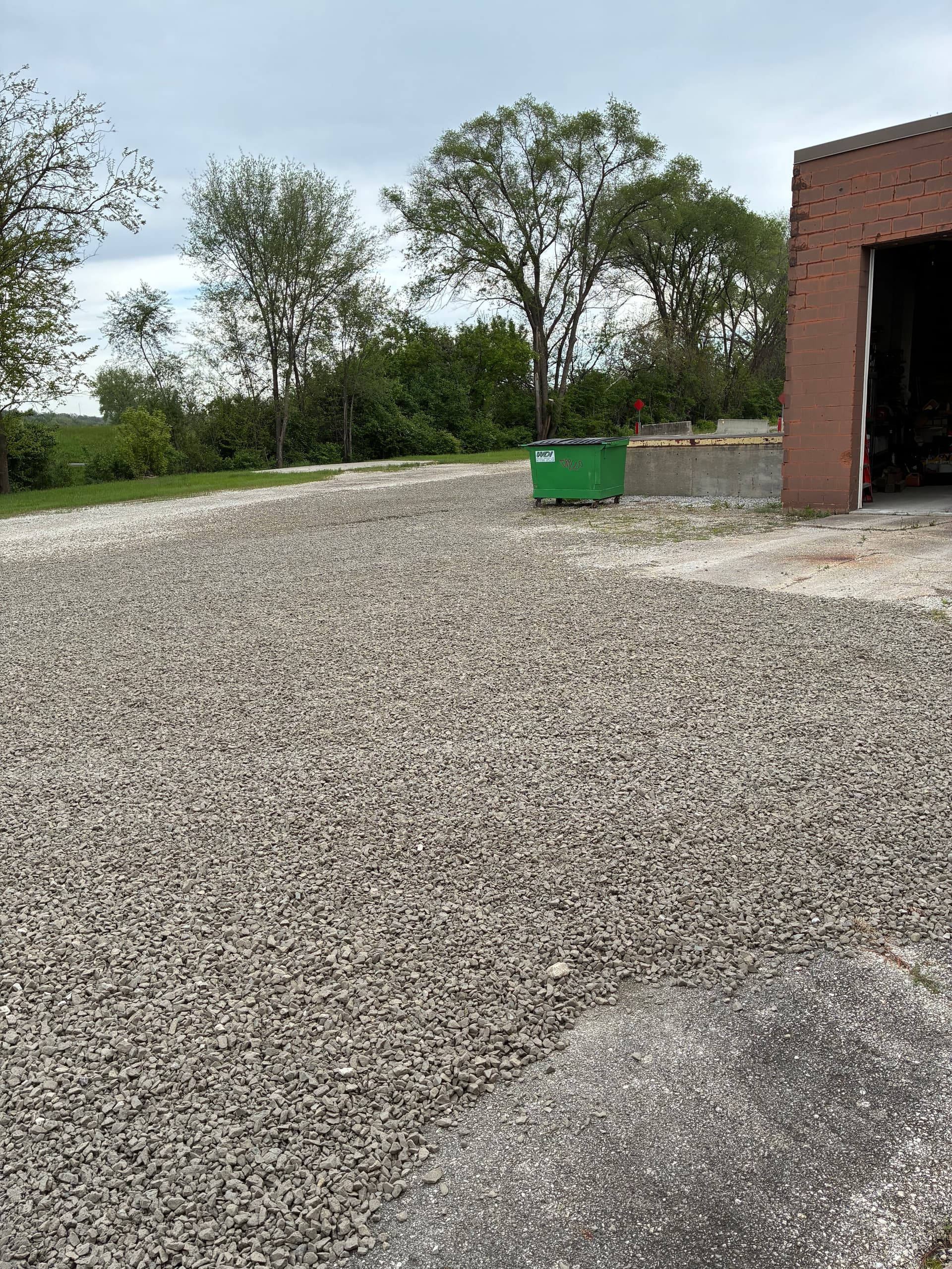 20 Tons of Gravel Fixes a Soggy Shop Lot in Central Des Moines