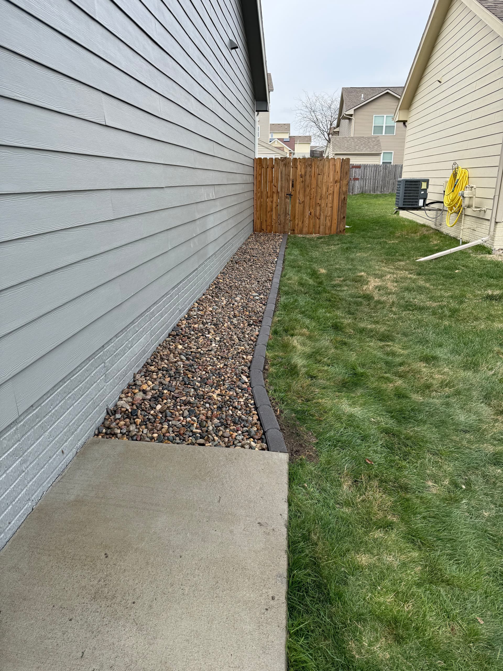 Gallery photos for River Rock and Bullet Edger Bed Install in Altoona Iowa: Image #3