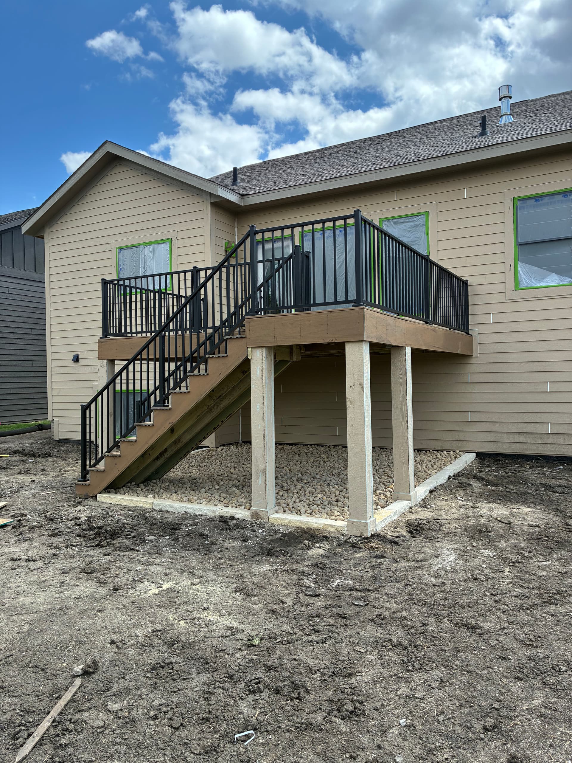 Gallery photos for New Construction Landscape Work with Iowa Buff and River Rock: Image #1