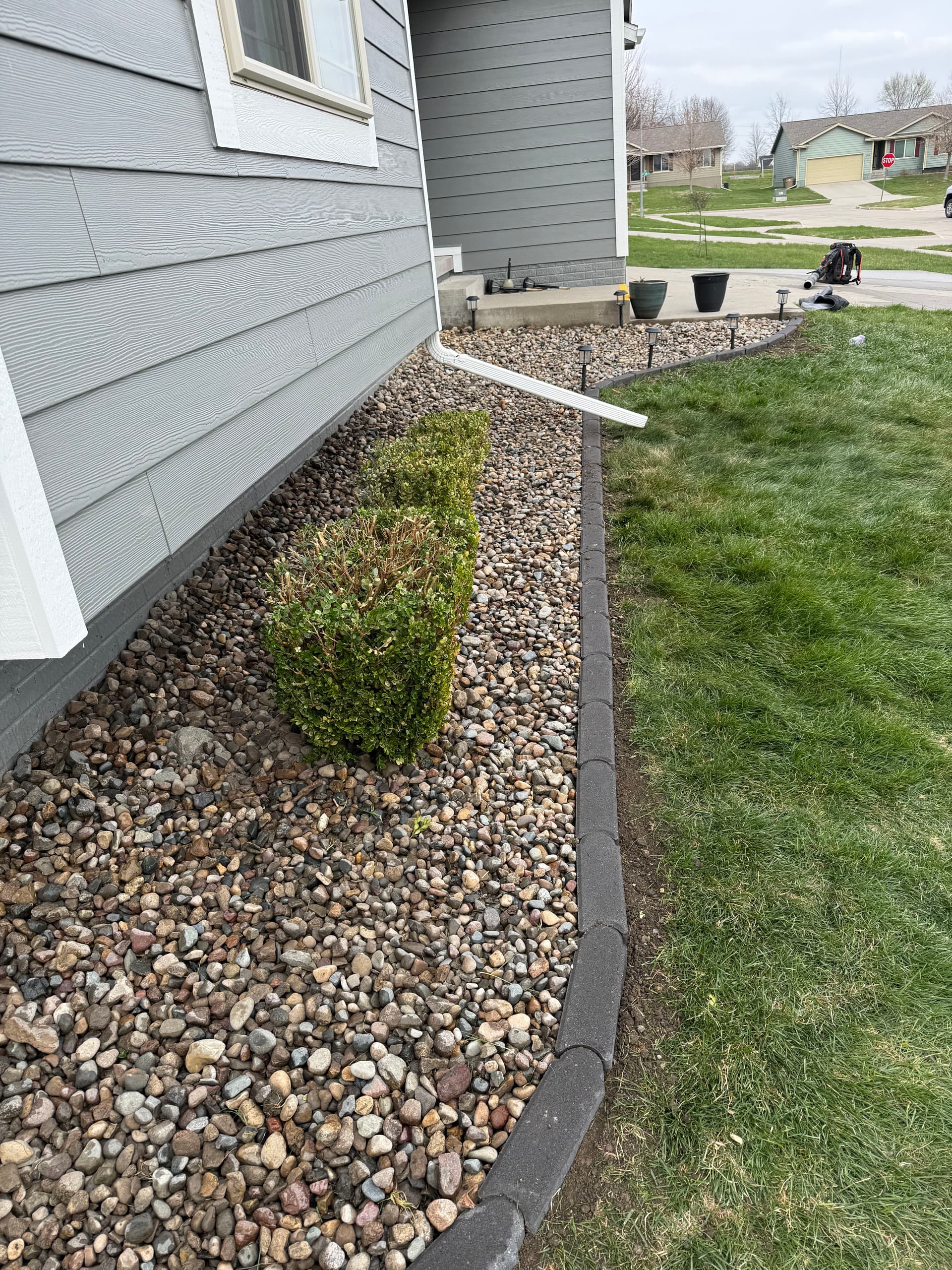Gallery photos for River Rock and Bullet Edger Bed Install in Altoona Iowa: Image #1