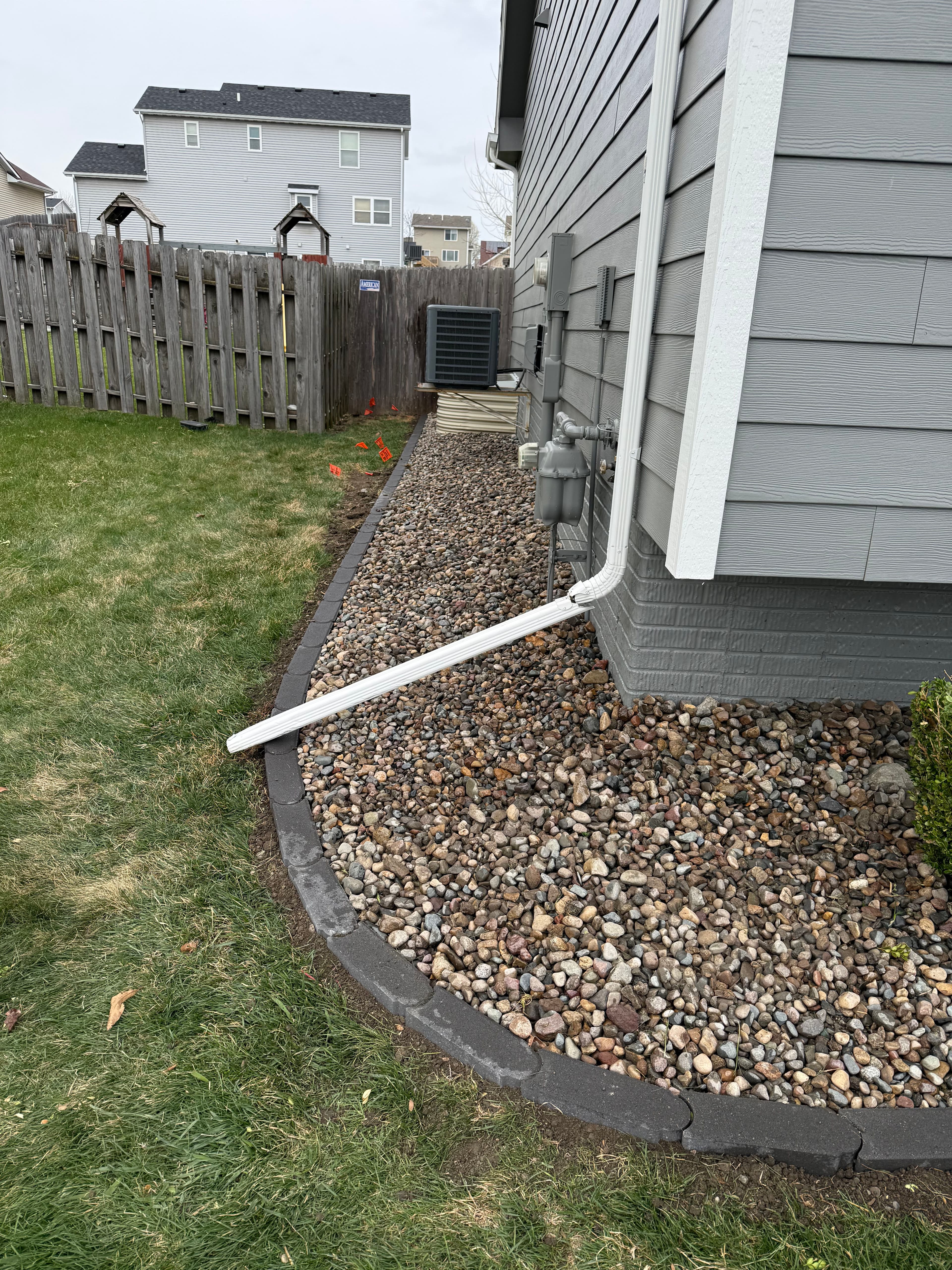 Project River Rock and Bullet Edger Bed Install in Altoona Iowa image