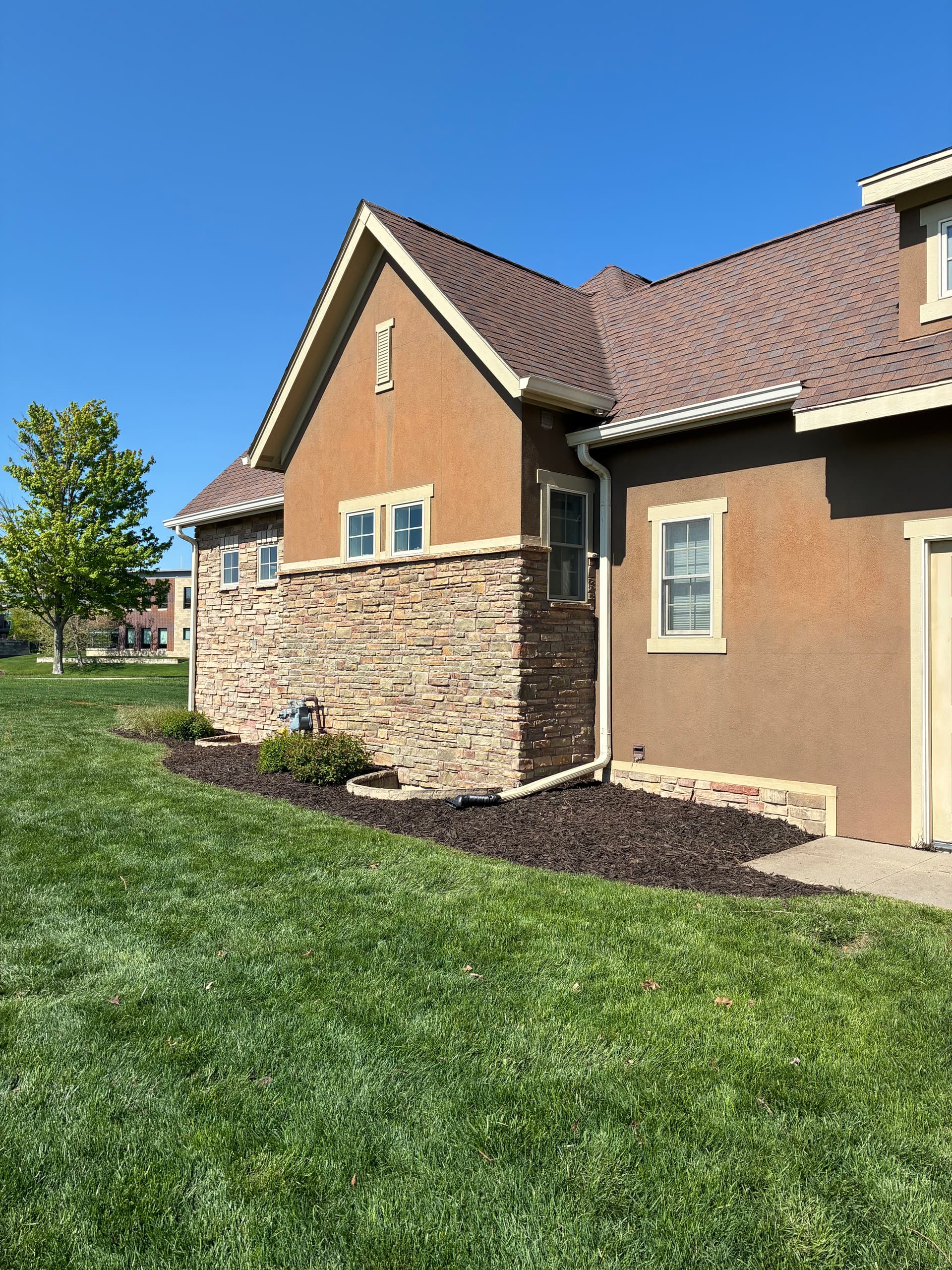 Fresh Mulch and Clean Bed Edges Give This Property a New Look image