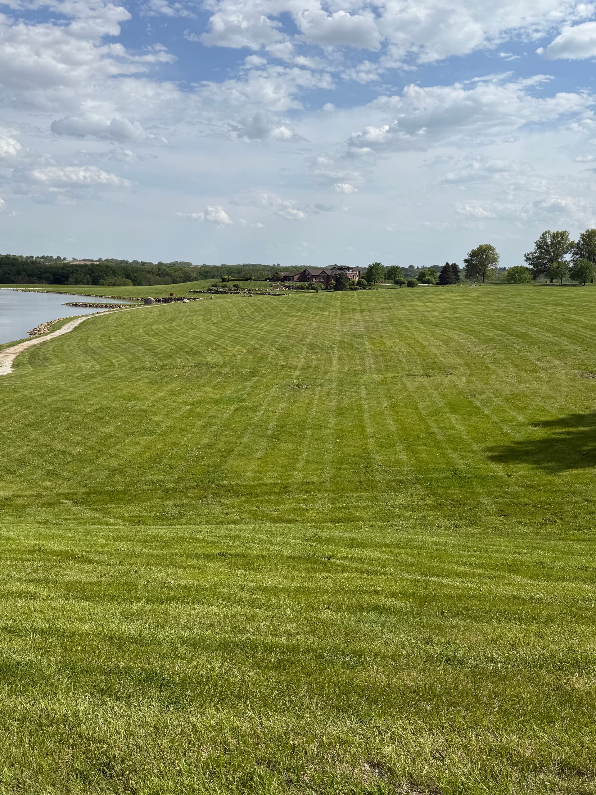 Clean Lawn Stripes Across 40 Acres of Rolling Property image