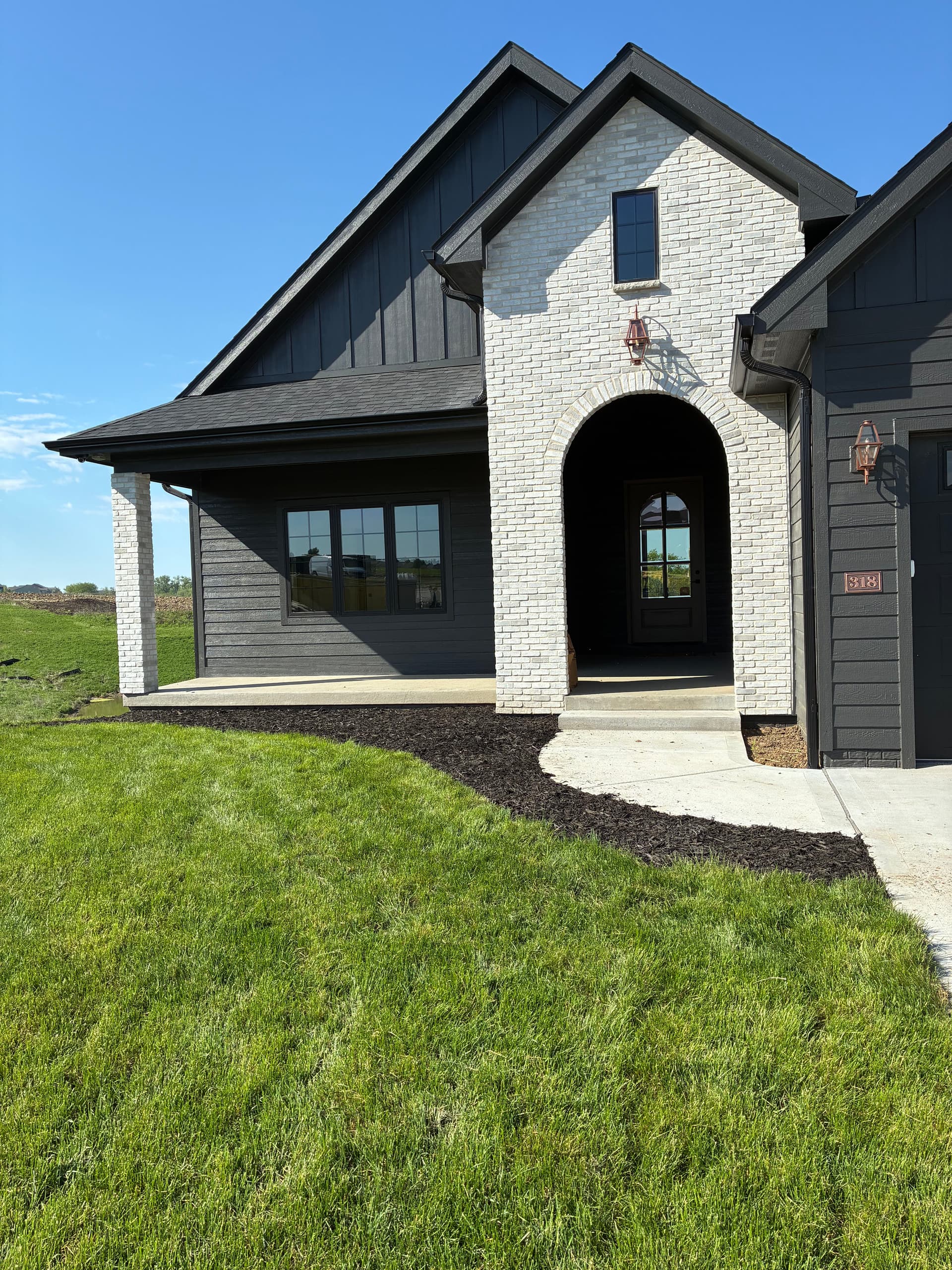 Fresh Black Mulch Beds Sharpen a Norwalk Property image
