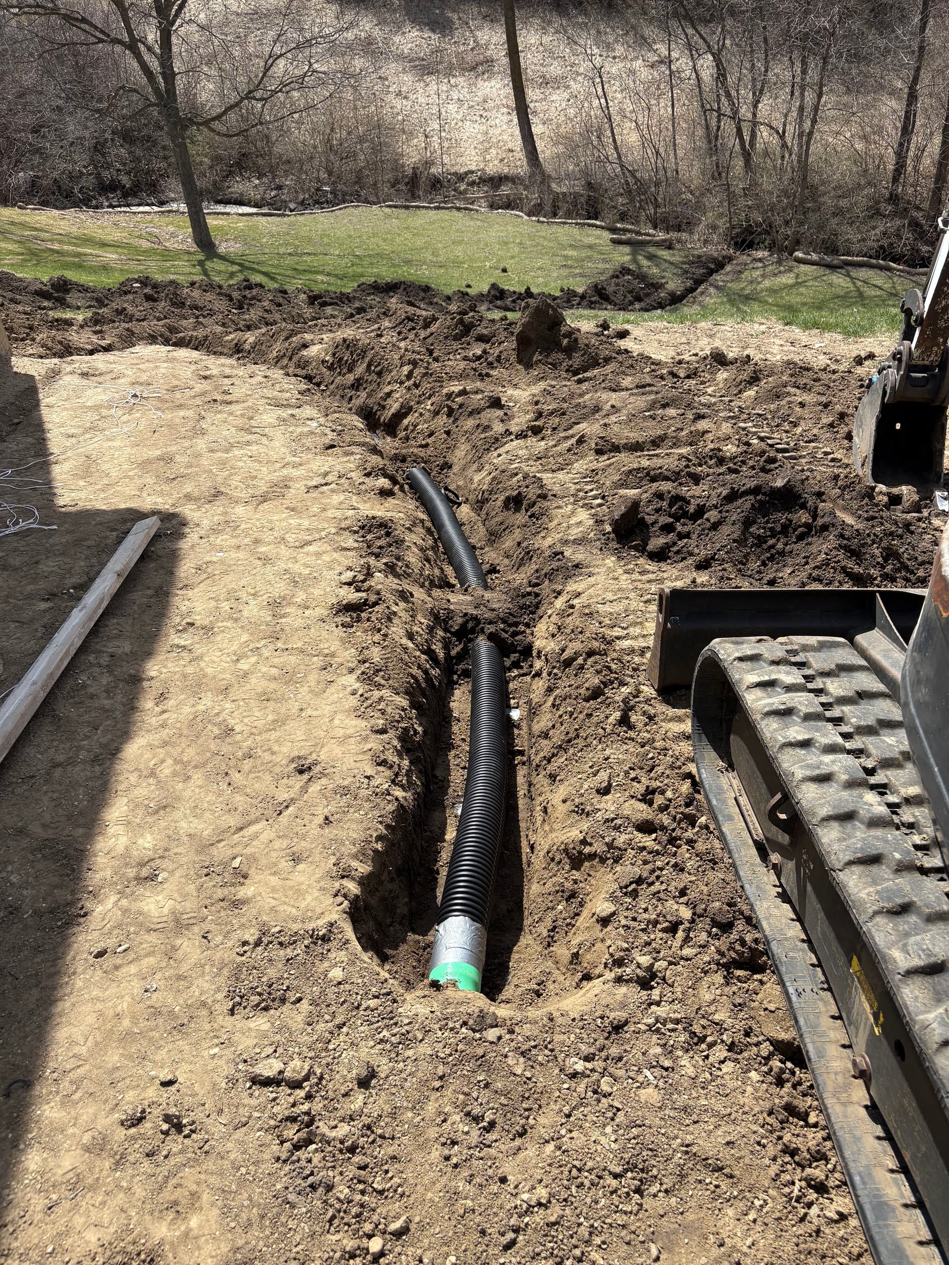 Gallery photos for French Drain Install, Full Regrade and Sod Around New Garage in Ankeny: Image #1