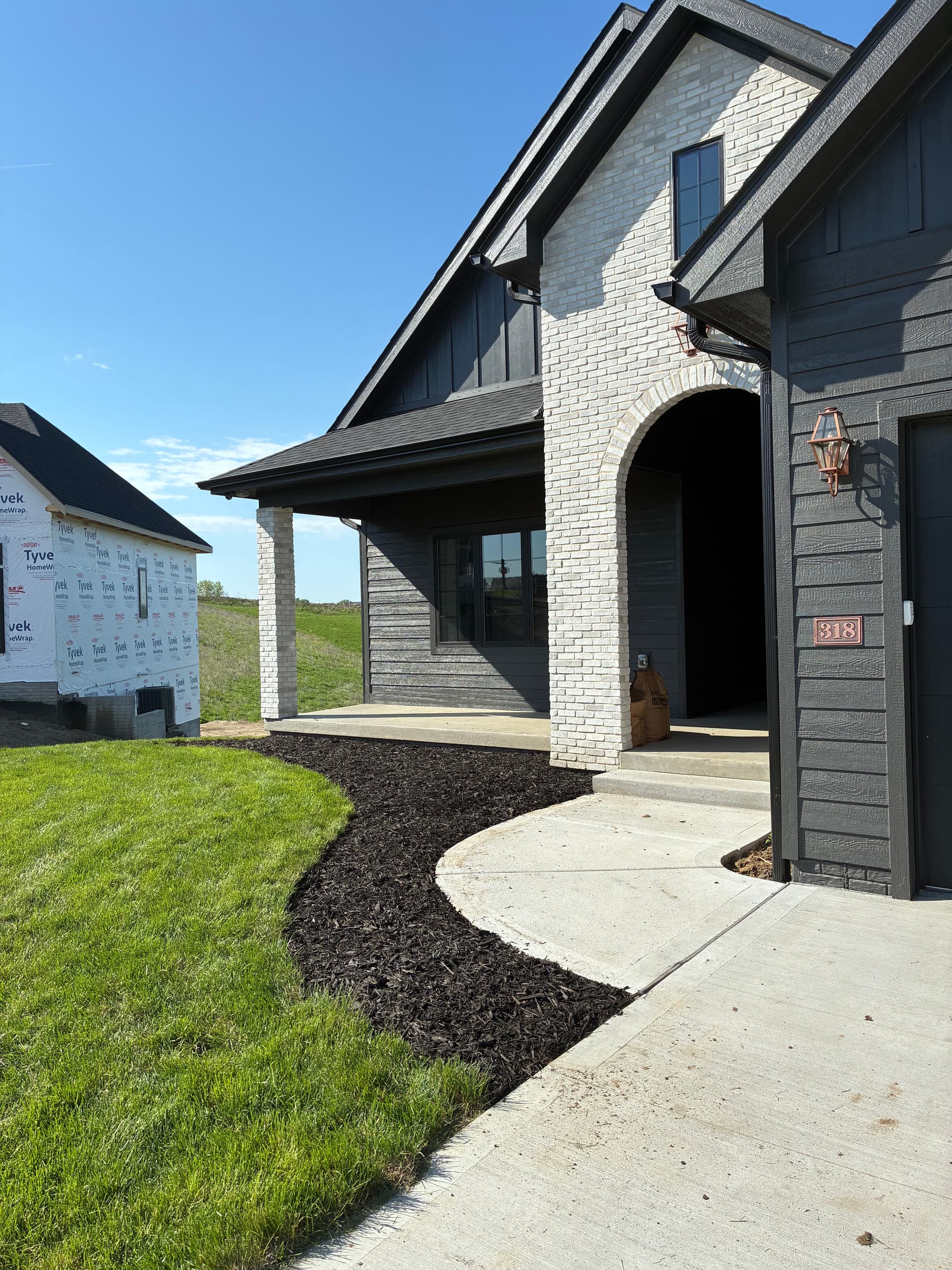 Gallery photos for Fresh Black Mulch Beds Sharpen a Norwalk Property: Image #1