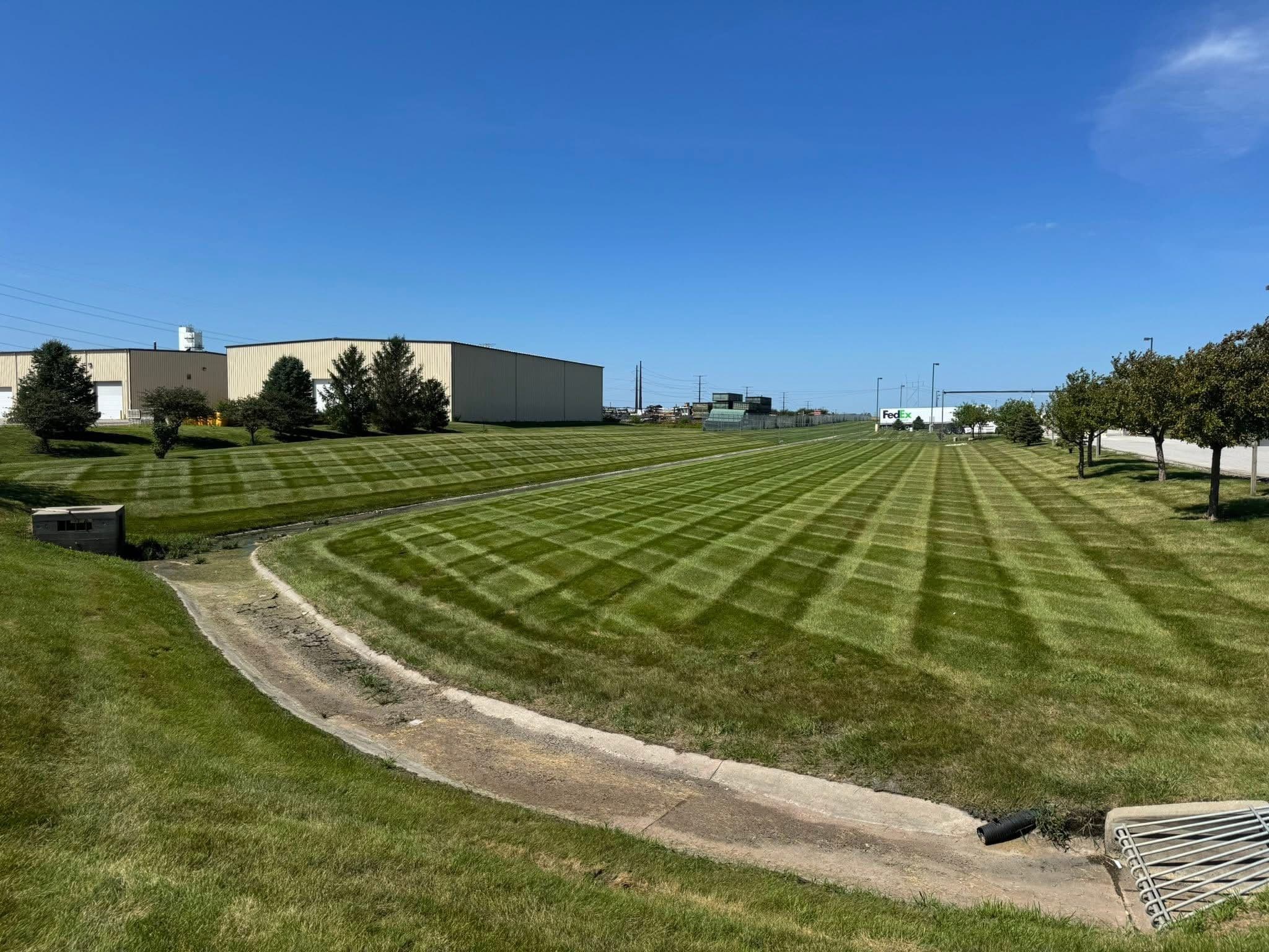 Project Weekly Commercial Lawn Mowing at a Grimes Trucking Facility image