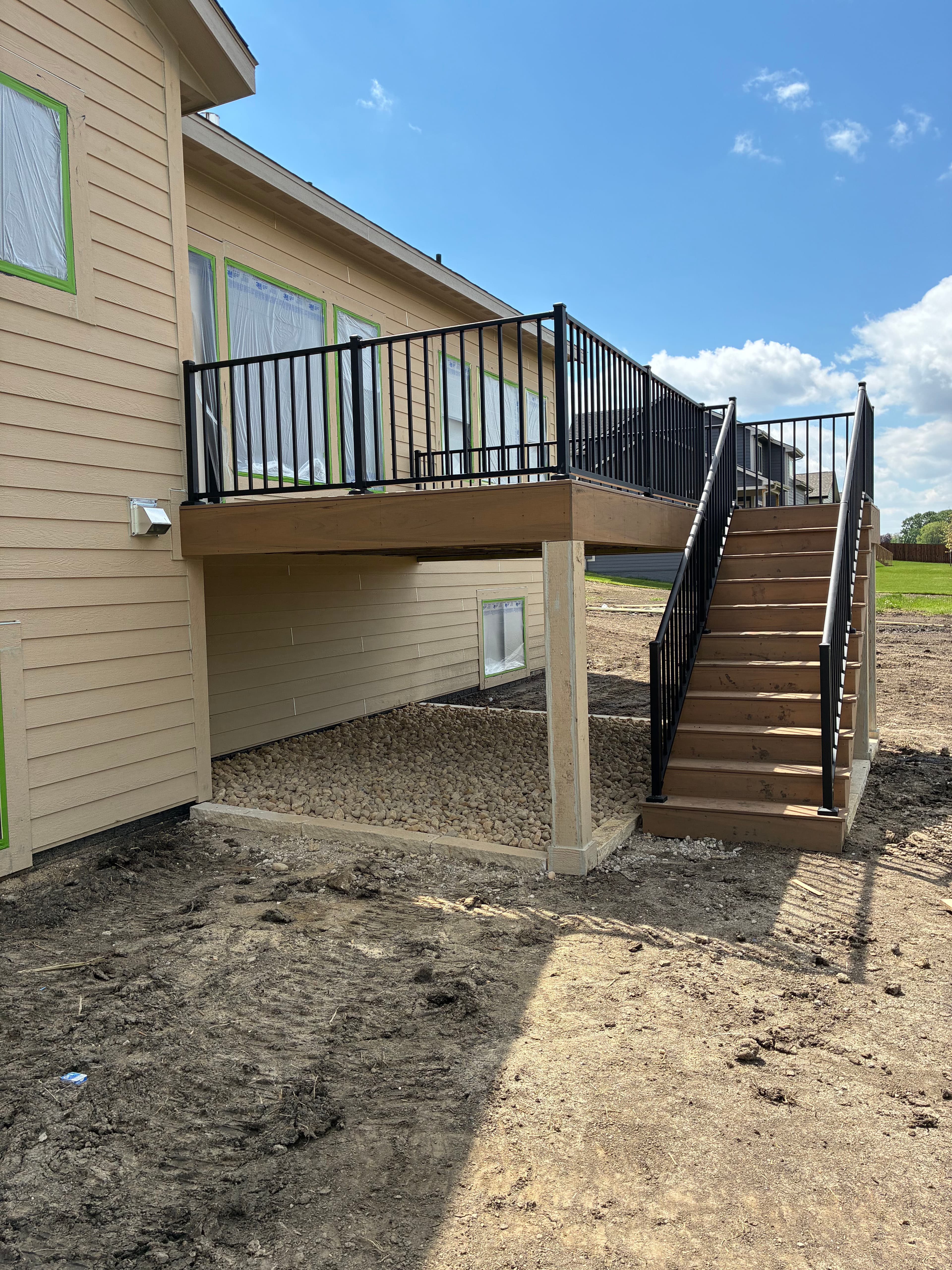 Project New Construction Landscape Work with Iowa Buff and River Rock image