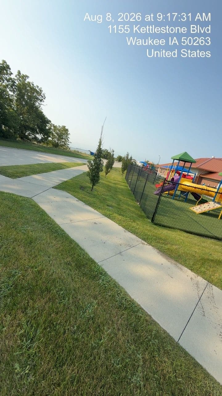 Gallery photos for Midseason Lawn Maintenance at a Waukee Daycare Property: Image #1