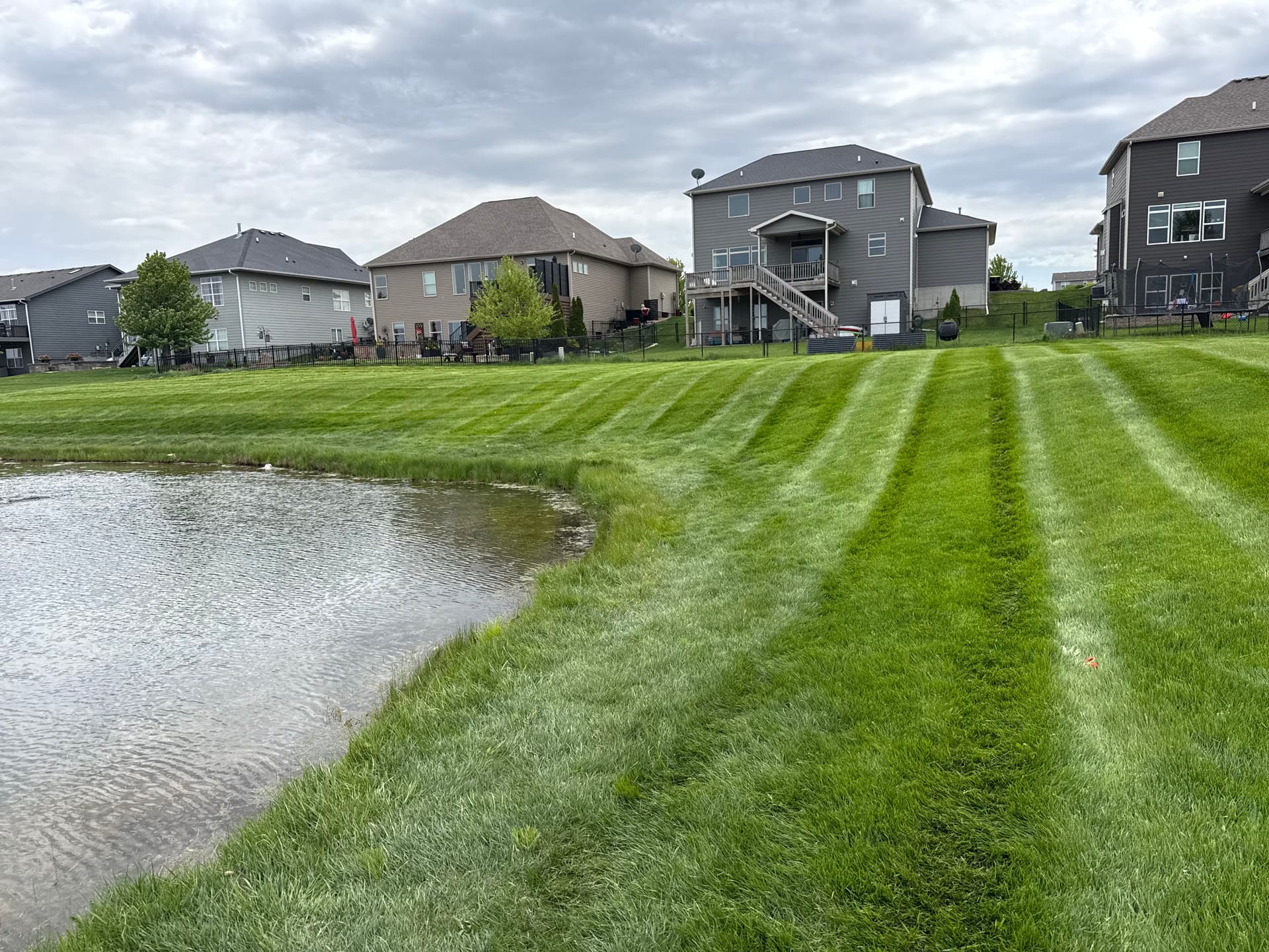 Gallery photos for HOA Pond Area Mowing Cleaned Up in Waukee: Image #2