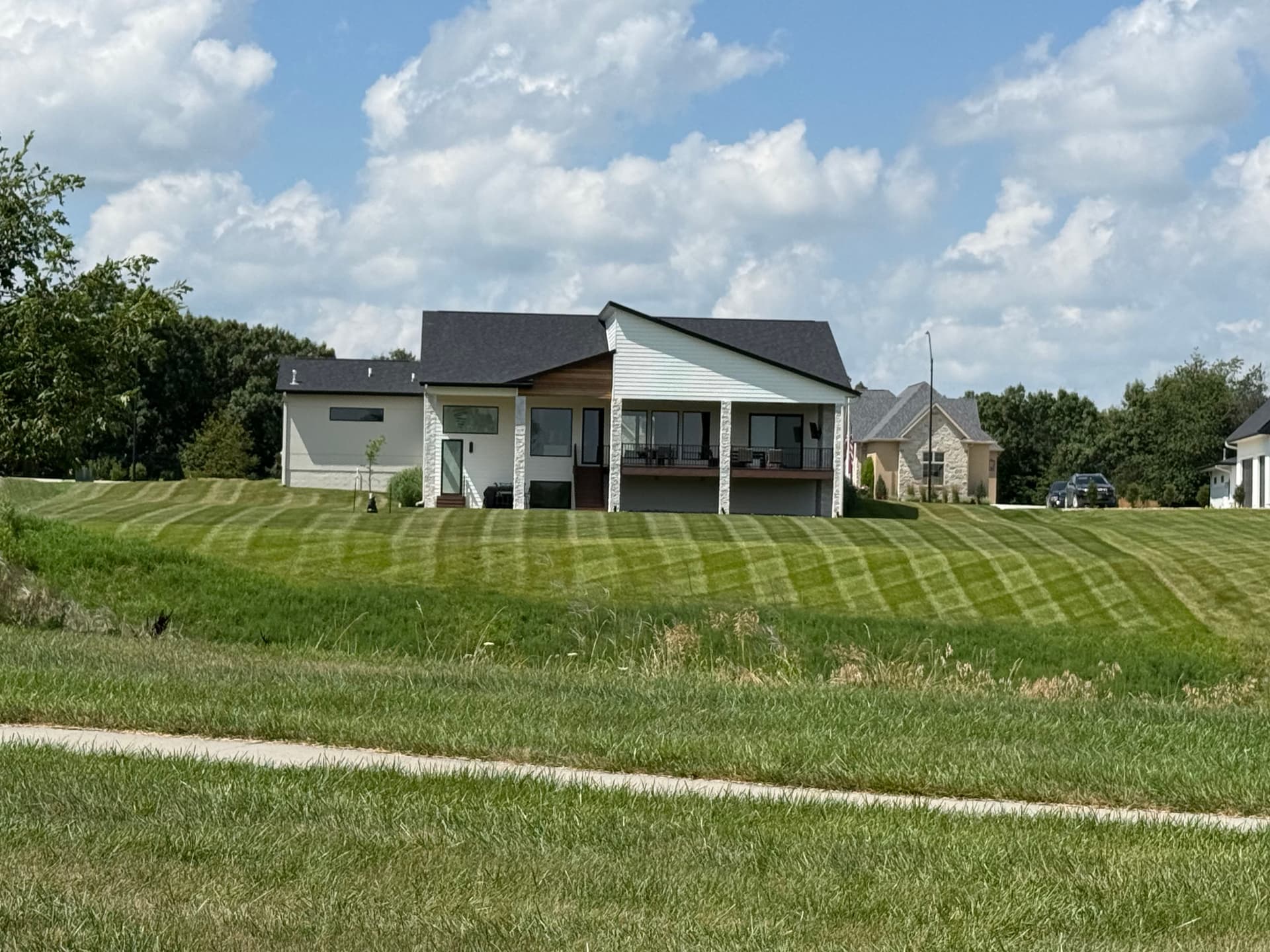 Clean Stripes on Neighboring Lawns in West Des Moines image